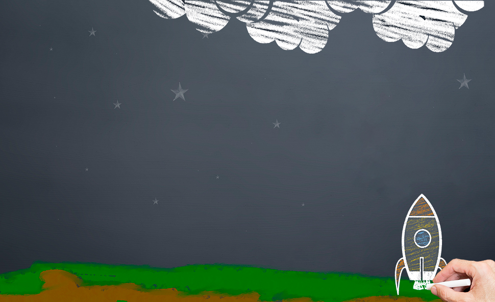 Rocket on launchpad sketch on chalkboard representing the build phase